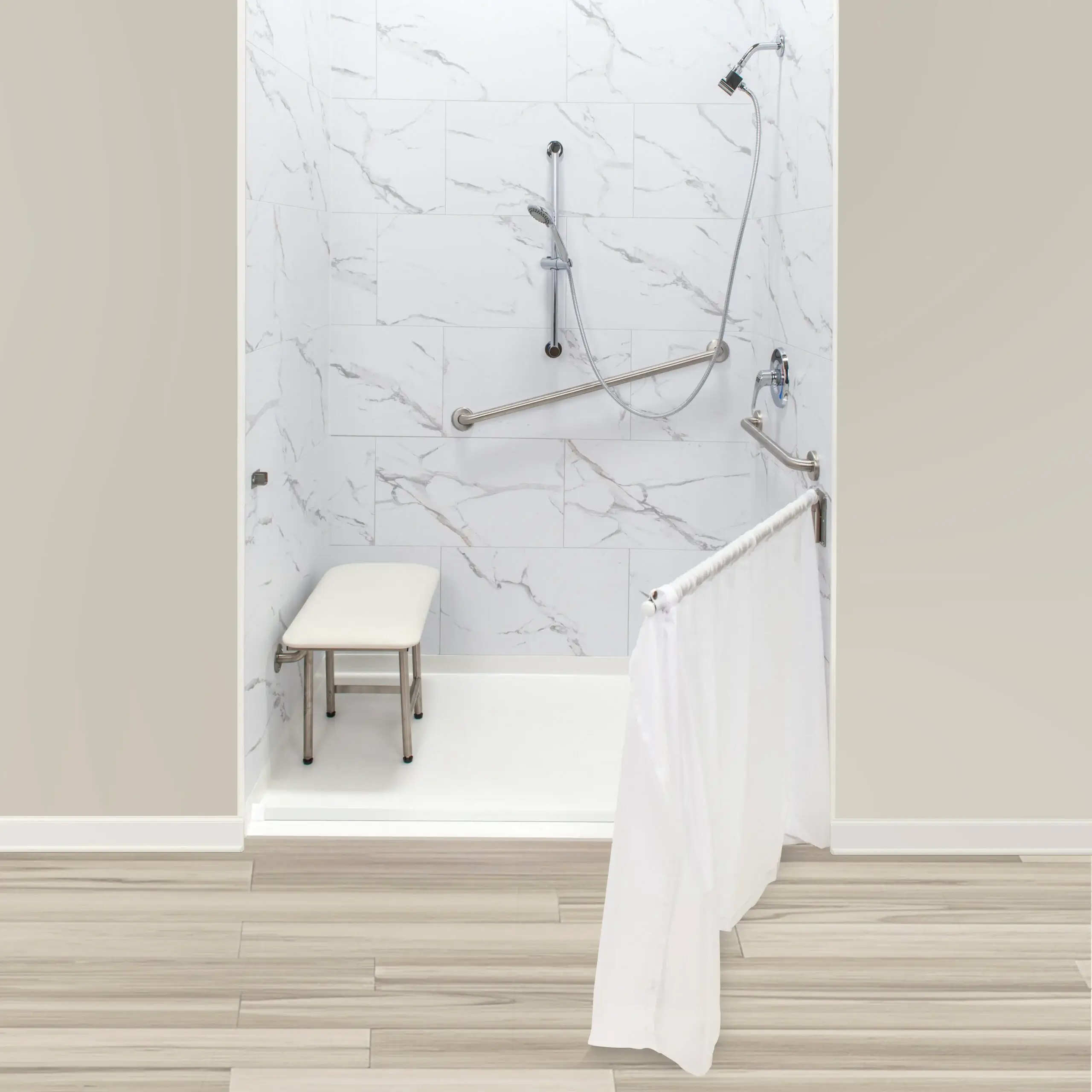Securely mounted grab bars beside a shower seat